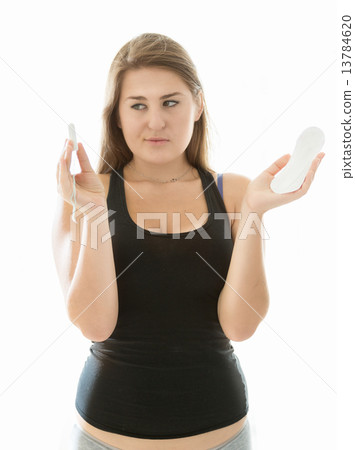 cute woman in lingerie holding tampon and menstrual pad 13784620