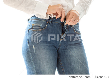 sexy woman putting on blue jeans 13784627