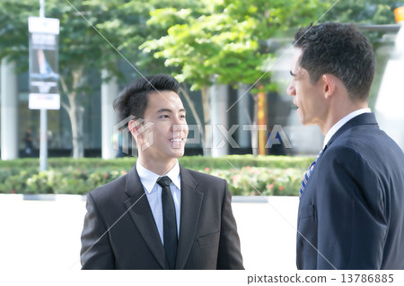 Business partners talking at the street 13786885