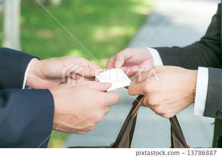 Businesspeople exchanging cards 13786887