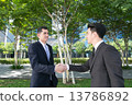 A handshake of business partners 13786892