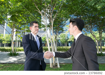 A handshake of business partners 13786892