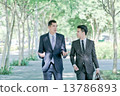 Two businessman walking and talking together 13786893