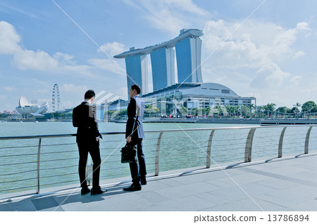 Two businessman are waiting for the client in front of Marina Bay Sands 13786894