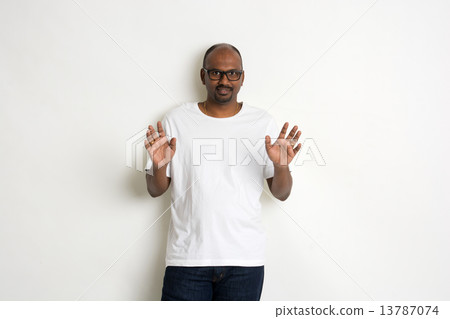 casual indian male shock look casual indian male shock look 13787074