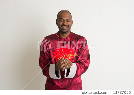 indian male with chinese new year clothes and ang pao indian male with chinese new year clothes and ang pao 13787090
