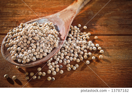white hot and spicy pepper on wood spoon 13787182
