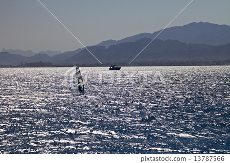 Silhouette of a windsurfer 13787566