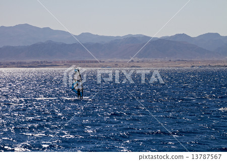 Silhouette of a windsurfer Silhouette of a windsurfer 13787567