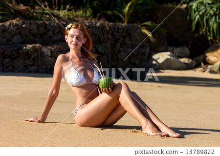 Young woman in bikini with cocktail 13789822