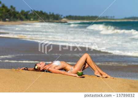 Young woman in bikini with cocktail 13789832