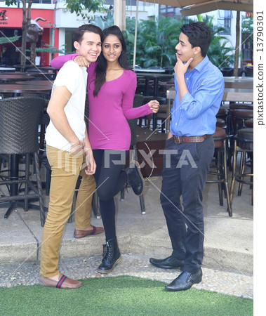 Young mixed race group outdoor pose  talk discuss 13790301