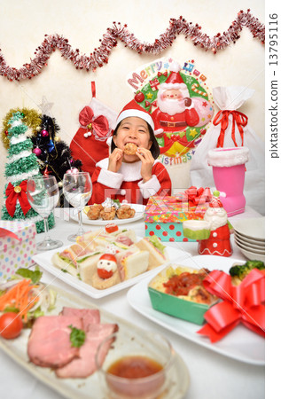 Santa Claus costume girls eating chicken Santa Claus costume girls eating chicken 13795116