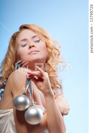 Young beautiful woman with snowy skin 13799726