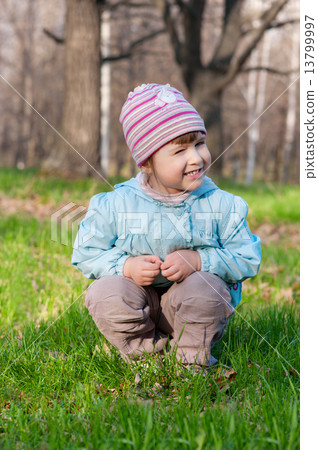 Little smiling girl at forest 13799997