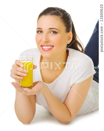 Smiling young girl with orange juice 13800620