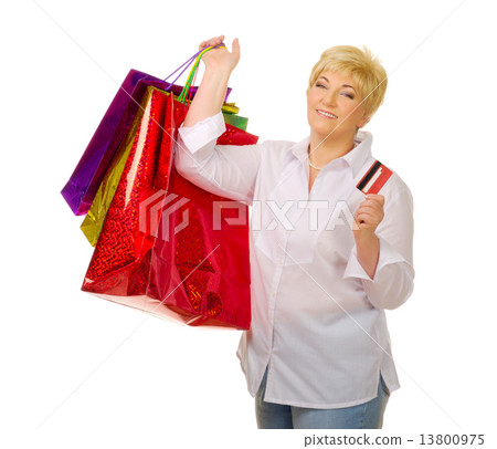 Mature woman with credit card and bags Mature woman with credit card and bags 13800975
