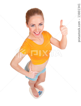 Young woman on scales 13801341