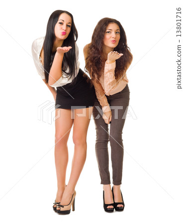 Two young girls sends air kisses 13801716