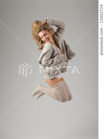 Fashion style portrait of young jumping girl Fashion style portrait of young jumping girl 13802724
