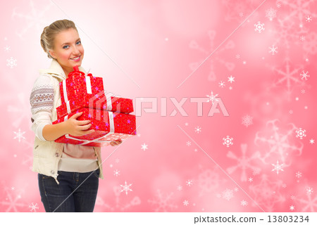 Young girl wth gift boxes on winter background Young girl wth gift boxes on winter background 13803234