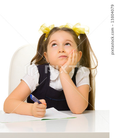 Schoolgirl at the table 13804079