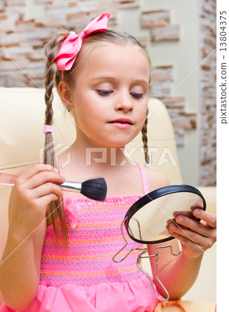 Little girl puts makeup Little girl puts makeup 13804375