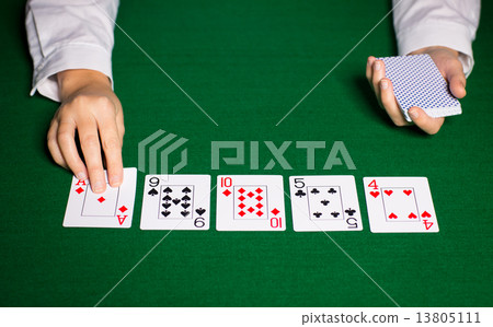 holdem dealer with playing cards 13805111