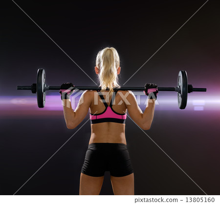 sporty woman exercising with barbell from back sporty woman exercising with barbell from back 13805160