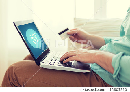 close up of man with laptop and credit card 13805210