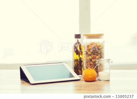close up of tablet pc olive oil, pasta and pumpkin 13805237
