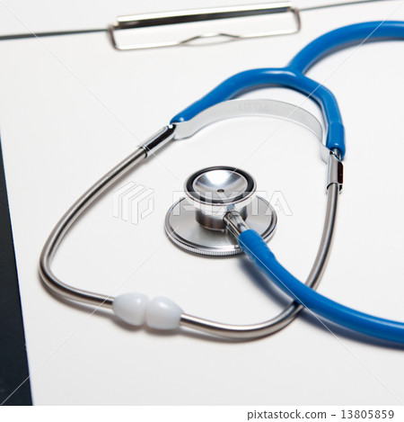 Stethoscope and pen on paper sheet 13805859
