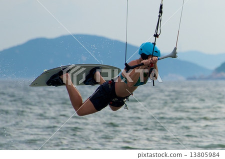 Close-up of female kite surfer going horizontal 13805984