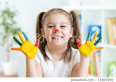 Cute little girl with painted hands Cute little girl with painted hands 13807048
