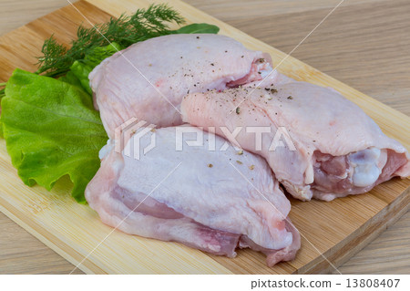 Raw chicken thighs Raw chicken thighs 13808407