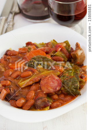 stew in the plate with glass of red wine 13808881