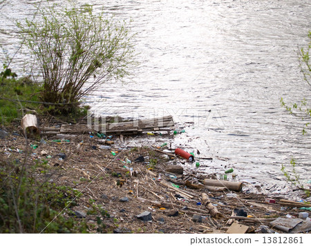 Rubbish on riverbank 13812861
