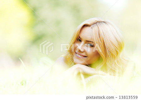 Young woman on grass 13813559