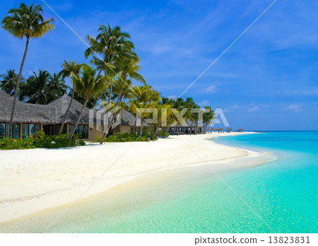 Beach bungalows on a tropical island Beach bungalows on a tropical island 13823831