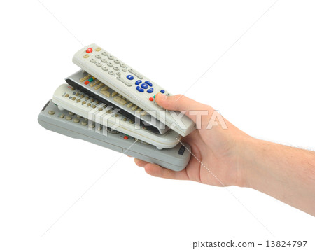 Remote controls in hand Remote controls in hand 13824797