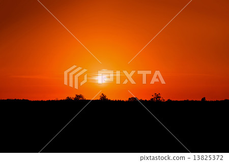 Beautiful red sunset on a countryside 13825372