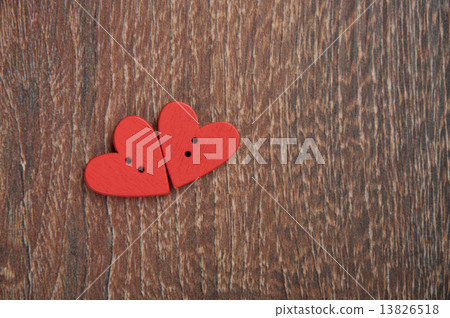 two wooden red hearts on the wooden board 13826518