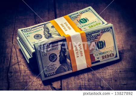 Stacks of new 100 US dollars 2013 banknotes bills 13827892