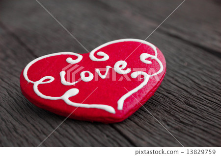 Heart cookie on wood background 13829759