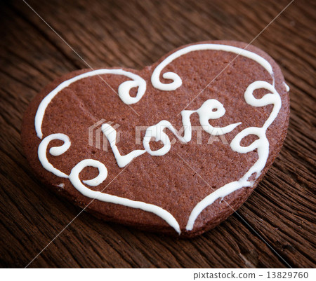 Heart cookie on wood background Heart cookie on wood background 13829760