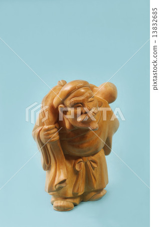 Stock Photo: the god of wealth, daikokuten, woodcarving