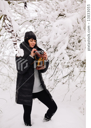 Beautiful brunette girl with a vintage camera Beautiful brunette girl with a vintage camera 13833055