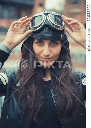 aviator young beautiful brunette woman with cap and glasses 13833822