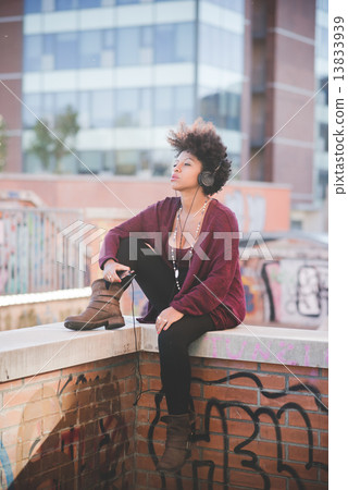 beautiful black curly hair african woman listening music with he beautiful black curly hair african woman listening music with he 13833939