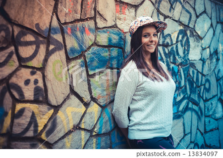 young beautiful brunette straight hair woman in the park 13834097